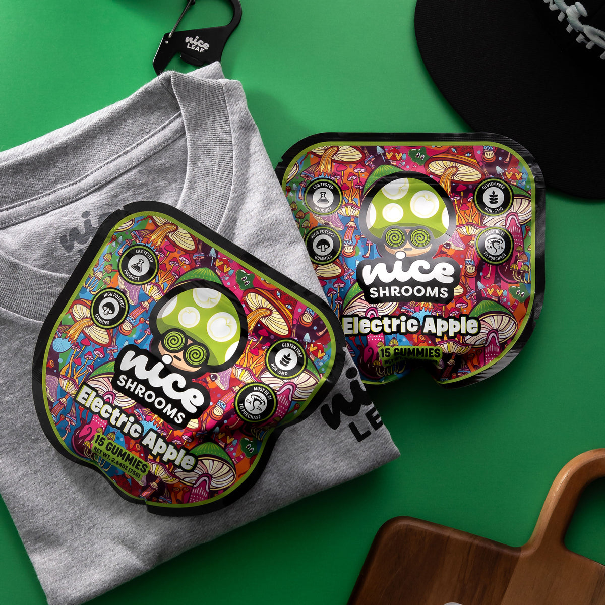 nice shrooms electric apple gummies bags on a green background with nice leaf shirt